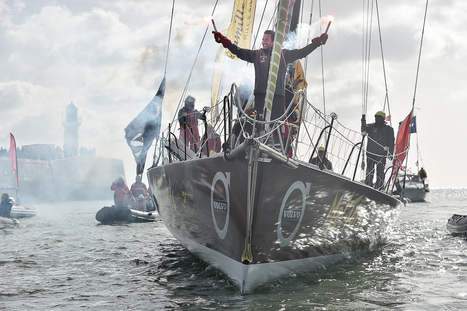 French skipper Romain Attanasio, placing 15th in the Vendee Globe around-the-world solo sailing race, celebrates aboard his Imoca 60 monohull 