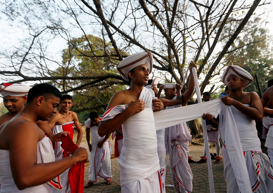 Sri Lankan traditional dancers prepare for the annual Nawam Perahera (street pageant) in Colombo. PHOTO: REUTERS
