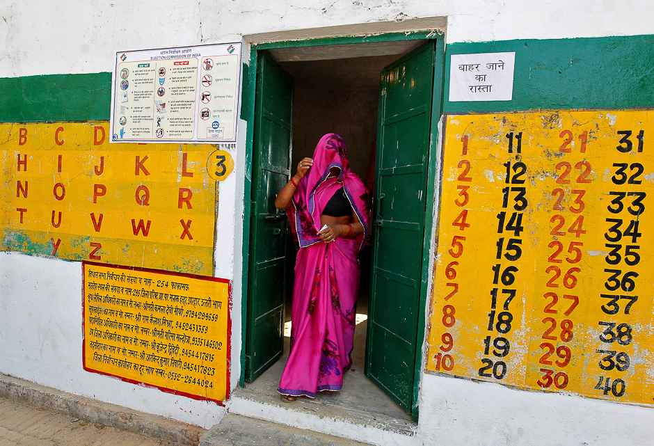A woman leaves after casting her vote at a polling station during the fourth phase of the state assembly election in Allahabad, India. PHOTO: REUTERS