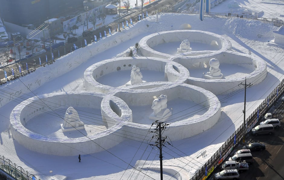 This photo taken shows the snow sculpture shaped of the Olympic rings at the town of Hoenggye, near the venue for the opening and closing ceremonies for the upcoming Pyeongchang 2018 Winter Olympic Games, in Pyeongchang. PHOTO: AFP