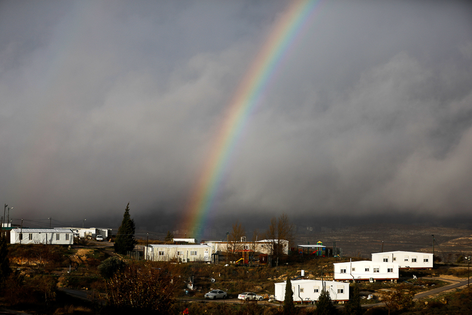 A rainbow is seen over the Israeli settler outpost of Amona in the occupied West Bank. PHOTO: REUTERS