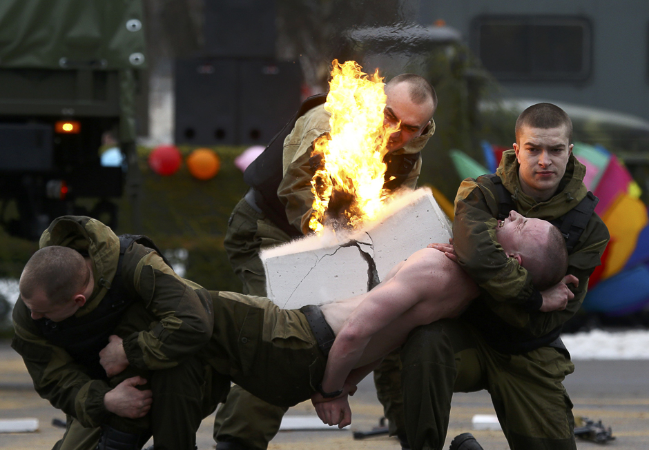 Servicemen of the Belarussian Interior Ministry's special forces unit perform during Maslenitsa celebrations, a pagan holiday marking the end of winter celebrated with pancake eating and shows of strength, at their base in Minsk, Belarus. PHOTO: REUTERS