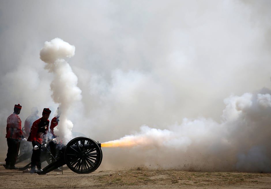 Members of Nepalese army fire a cannon during the rehearsal for the upcoming Army Day celebration at Tundhikhel in Kathmandu, Nepal. PHOTO: REUTERS