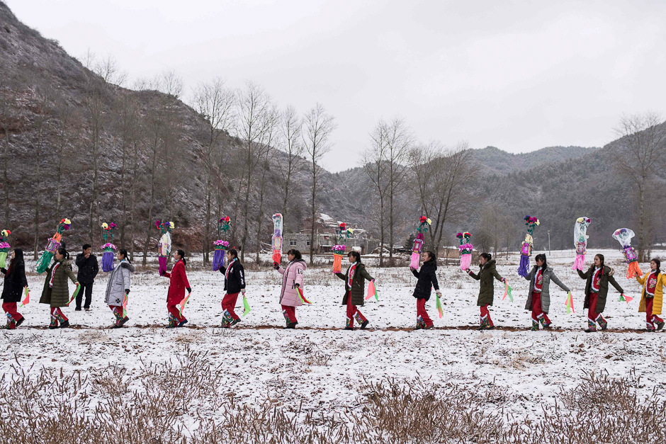 This photo taken shows Chinese entertainers preparing to perform a local folk performance during the Lunar New Year celebration in a village in Longnan, northwest China's Gansu province. PHOTO: AFP