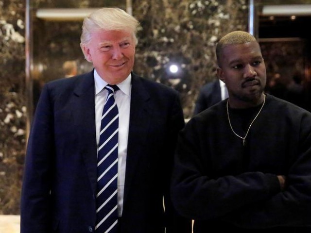 US President-elect Donald Trump and musician Kanye West pose for media at Trump Tower in Manhattan, New York City, US, December 13, 2016.  REUTERS/Andrew Kelly