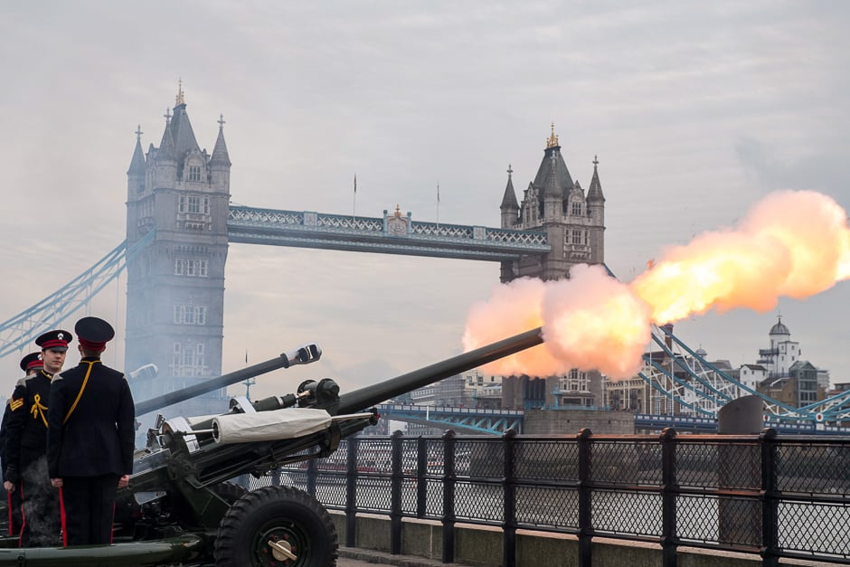 Members of the Honourable Artillery Company fire a 62 round royal gun salute from the Gun Wharf outside the Tower of London with Tower Bridge seen in the background to mark the anniversary of Queen Elizabeth II's accession to the throne in London. PHOTO: AFP