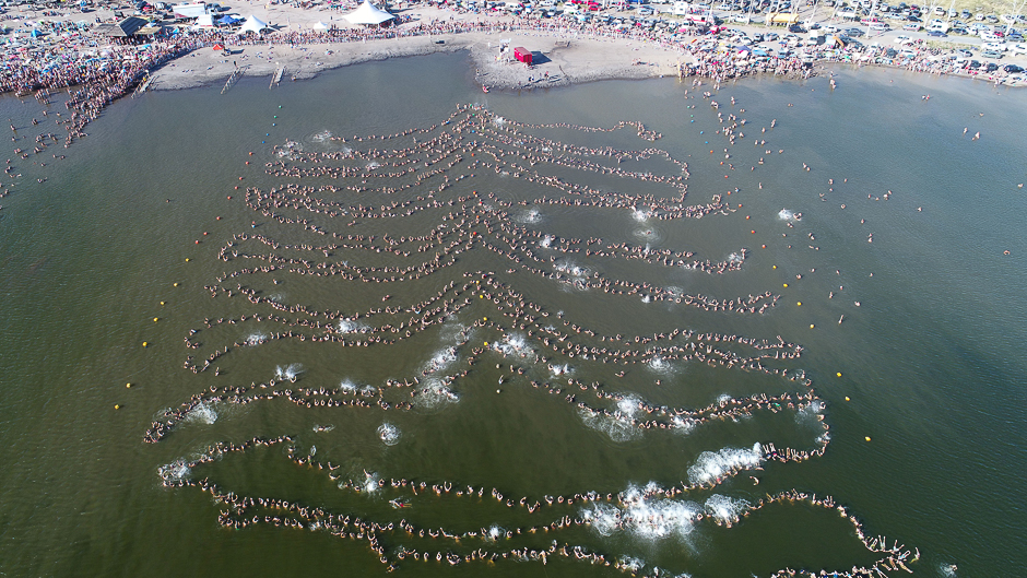 Nearly 2,000 people float in a line setting a new Guinness world record for the most people floating while holding hands in Lake Epecuen, a salty lake, near Carhue, Argentina. PHOTO: REUTERS