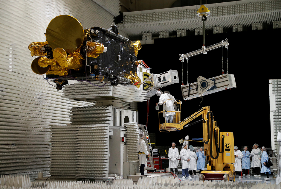 Technicians work on the Korean satellite Koreasat 5A in the clean room facilities of the Thales Alenia Space plant in Cannes, France. PHOTO: REUTERS