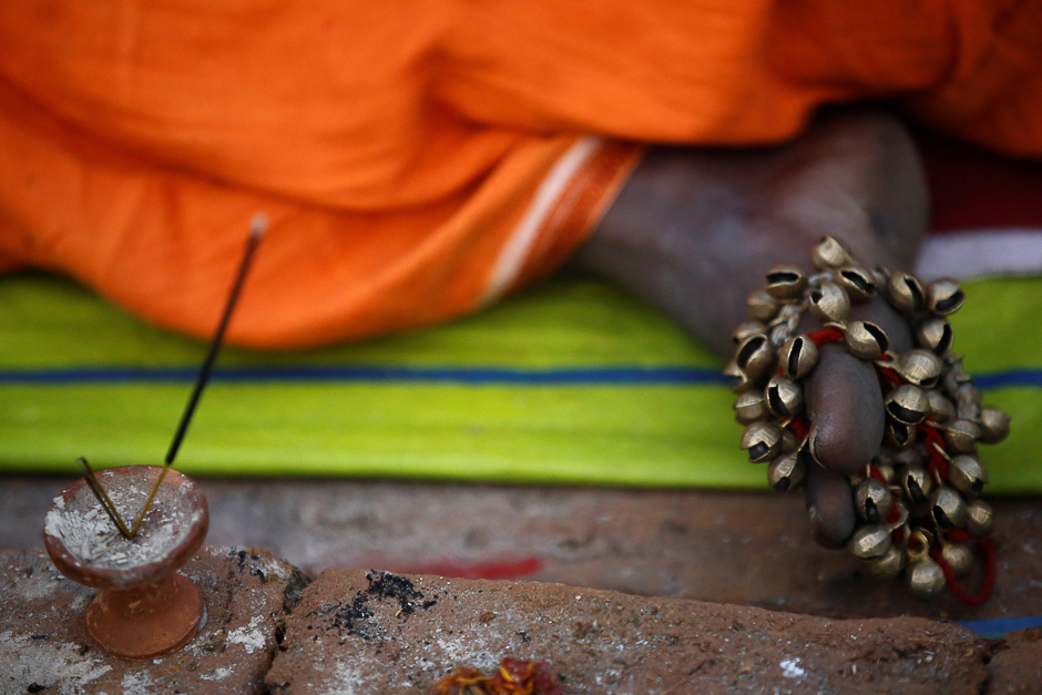 A musical instrument is pictured on the feet of a Hindu holy man, or sadhu, as he sits at the premises of Pashupatinath Temple during the Shivaratri festival in Kathmandu, Nepal. PHOTO: REUTERS