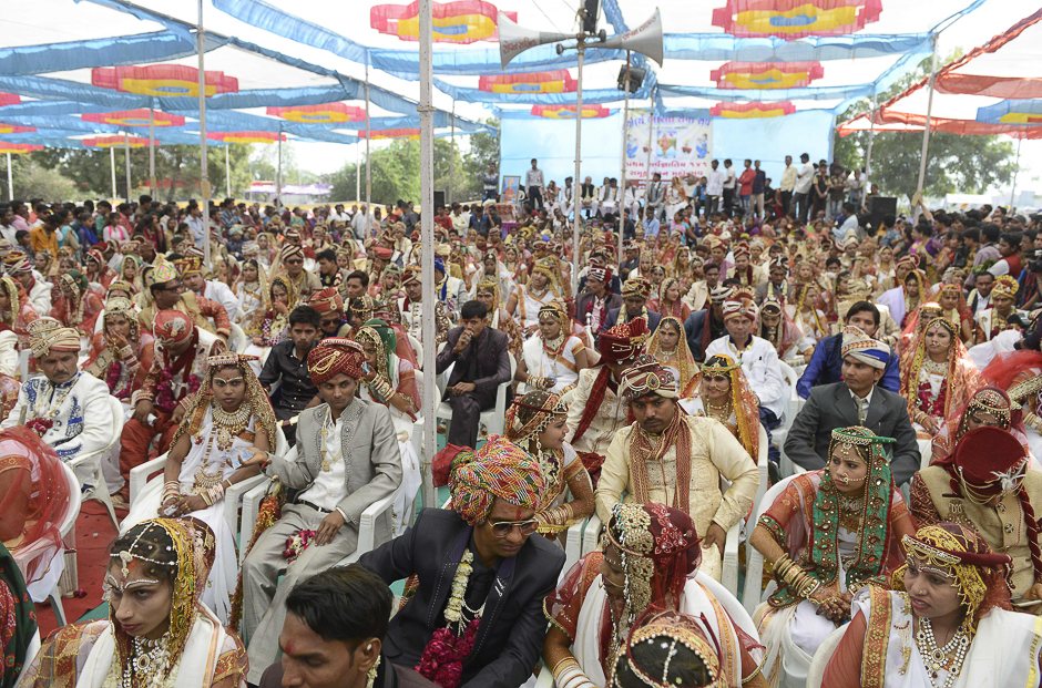 Indian couples in traditional outfits take part in a mass wedding ceremony on the outskirts of Ahmedabad. PHOTO: AFP