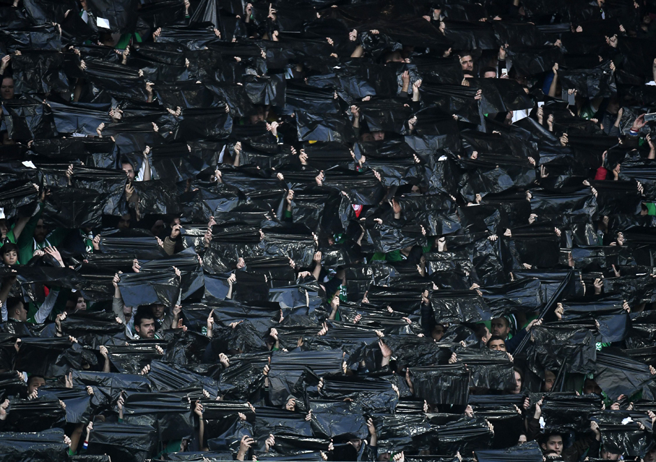 Saint-Etienne's supporters hold black plastic bags during the UEFA Europa League football match between AS Saint-Etienne and Manchester United, at the Geoffroy Guichard stadium in Saint-Etienne, central France. PHOTO: AFP