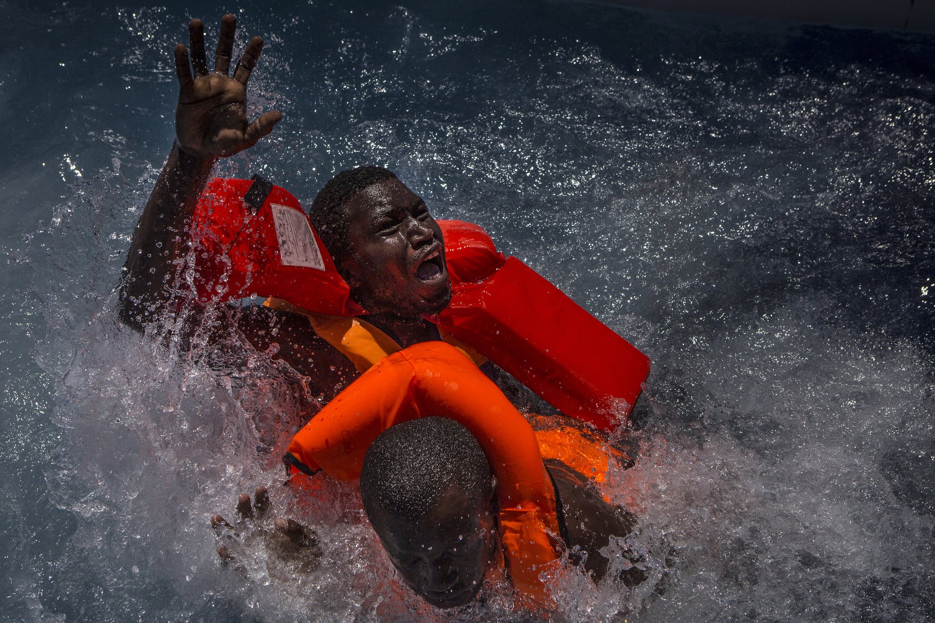 Spot news â stories, third prize Two men struggle in the water during a rescue in the Mediterranean Photograph: Mathieu Willcocks/AP