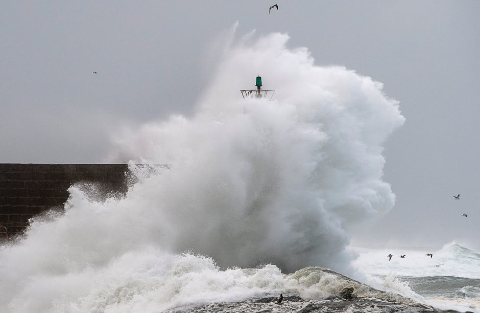 Big waves hit the jetty of the port of A Guarda, northwestern Spain, during a storm. PHOTO: AFP