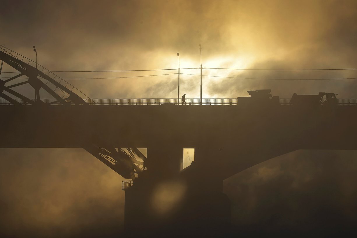 A man walks on a bridge over the Moskva river on a frosty morning, Moscow, Russia. PHOTO: REUTERS