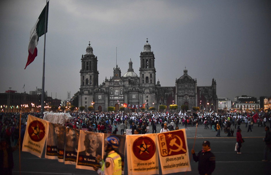 People gather at El Zocalo Square during a protest against the increase in the price of gasoline and US President Donald Trump's plan of building a wall between Mexico and the US, in Mexico City. PHOTO: AFP