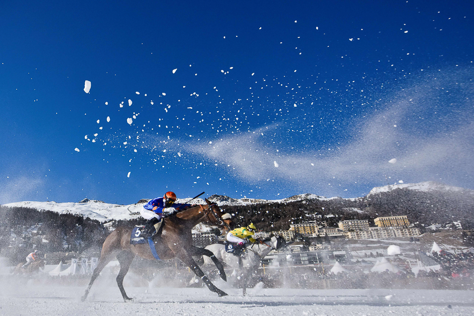 Clement Lheureux on his horse Cominols (L) and Milan Zatloukal on his horse Arche Pink take part in the 1800 metres flat race at the White Turf horse racing event in St Moritz. PHOTO: AFP