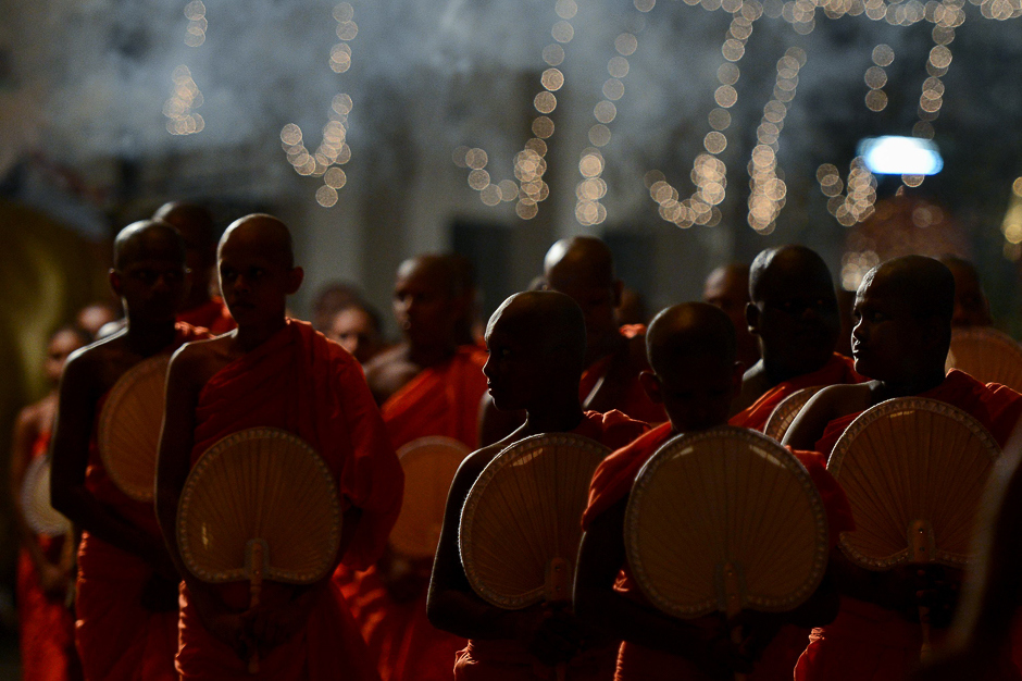 Sri Lankan Buddhist monks take part in a procession in front of the Gangarama Temple. PHOTO: AFP