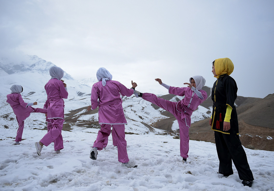 Afghan members of a Wushu martial arts group display their skills as they pose for a photograph at the Shahrak Haji Nabi hilltop overlooking Kabul. PHOTO: AFP