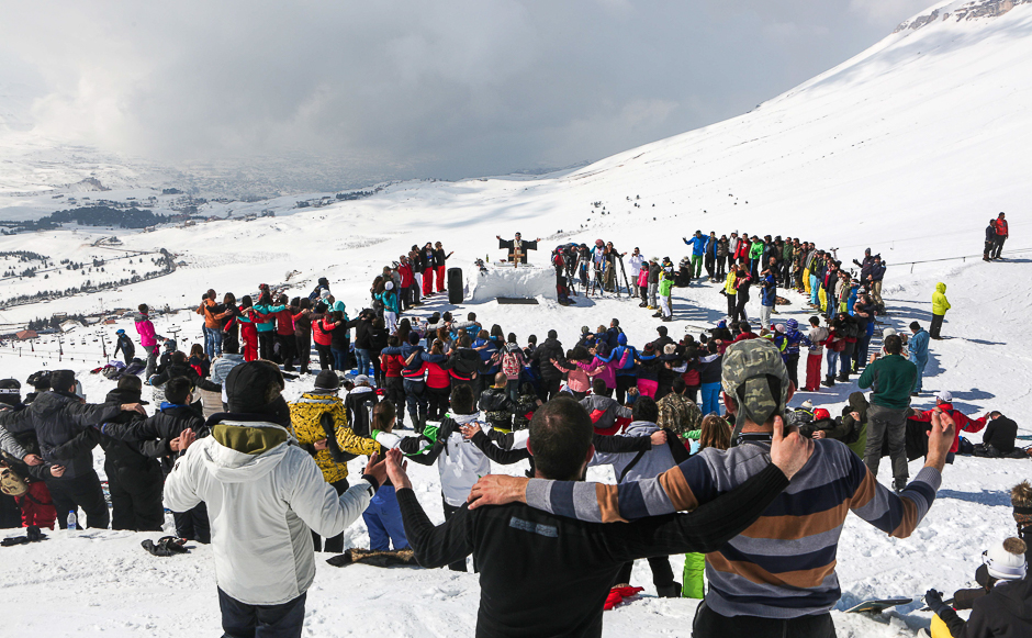 Lebanese Christian Maronite father Hani Taouk leads a mass on the ski slopes of the Cedars Mountains, celebrating the Feast of Saint Maron. PHOTO: AFP