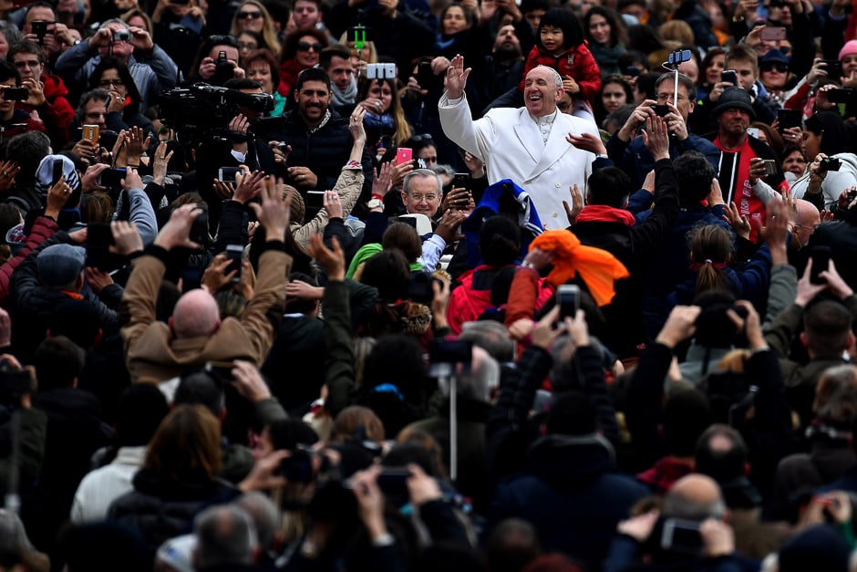 Pope Francis gestures as he arrives for his weekly general audience at St. Peter's square on February 22, 2016 at the Vatican. PHOTO: AFP