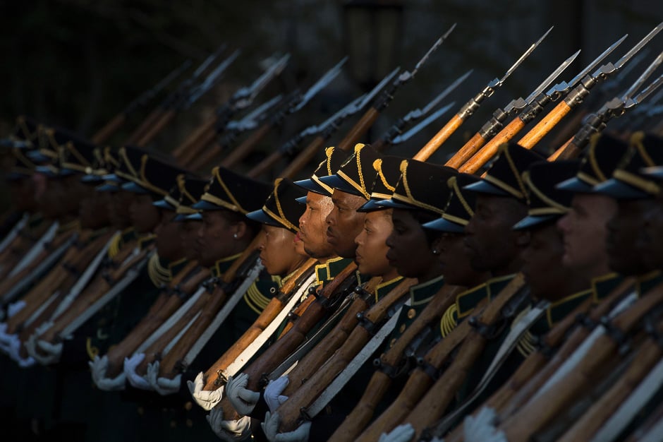 Members of the honour guard from the South African National Defence Force stands guard as South African president arrives at the South African Parliament, to deliver the 2017 State Of the Nation Address(SONA), and formally open Parliament for the year. PHOTO: AFP