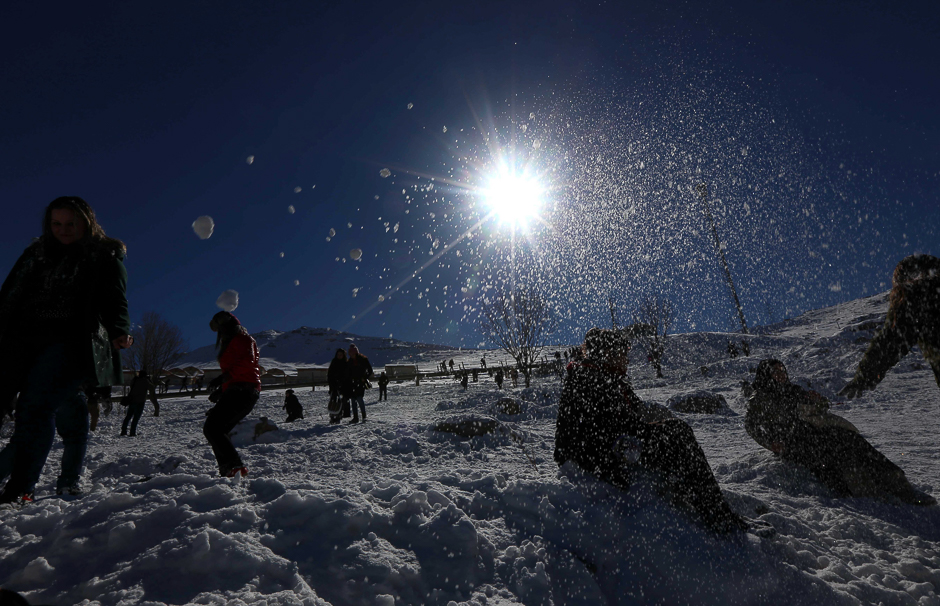 Iraqis play with snow at Korek Mountain resort near the city of Rawanduz in the Arbil Governorate of Iraqi Kurdistan. PHOTO: AFP