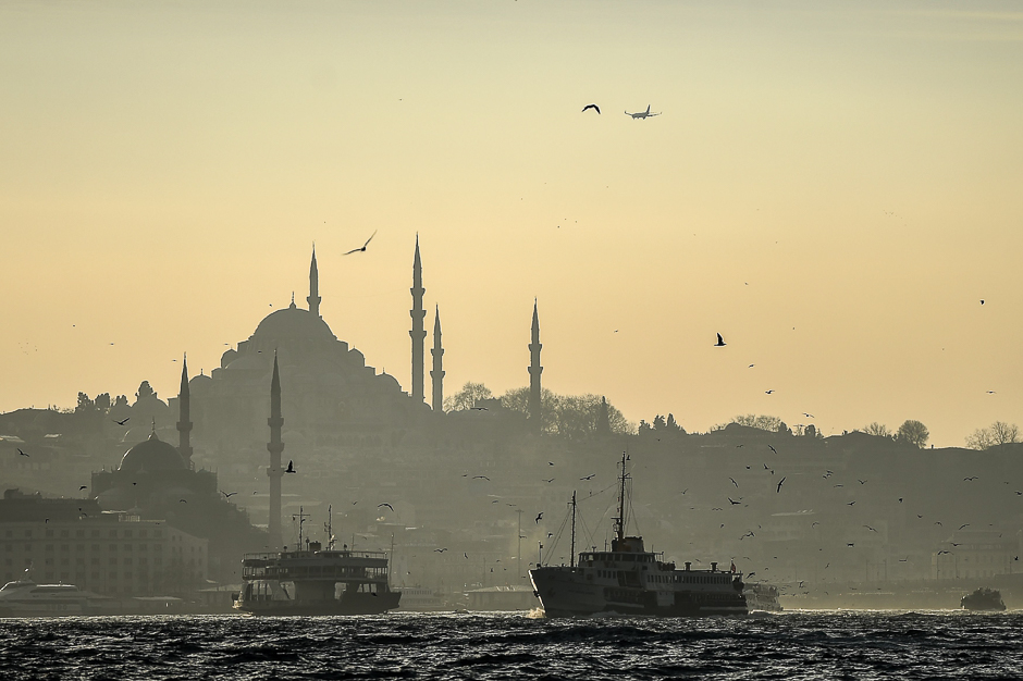 Ferries cross the Bosphorus as the Suleymaniye mosque appears in the background in Istanbul. PHOTO: AFP
