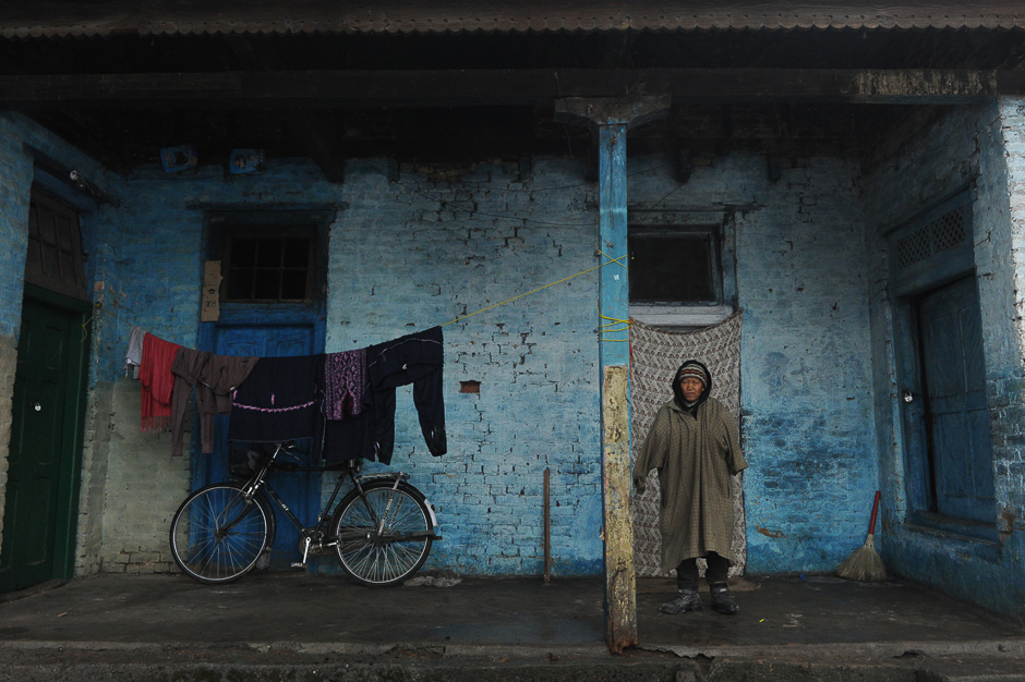 A leprosy patient stands outside a structure at the leprosy hospital in downtown Srinagar. PHOTO: AFP