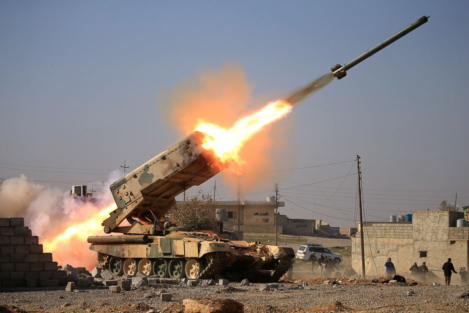 Iraqi army launch a rocket towards Islamic State militants during a battle with Islamic State militants near Ghozlani military complex, south of Mosul, Iraq . PHOTO: REUTERS
