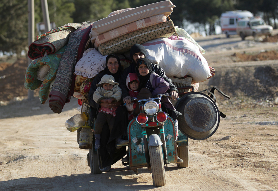 People who fled the violence from Islamic State-controlled northern Syrian town of al-Bab arrive in the rebel-held outskirts of the town, Syria. PHOTO: REUTERS
