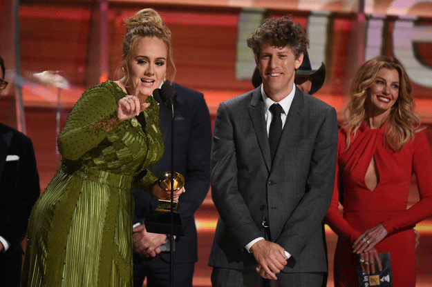 Adele (L) addresses the crowd during the 59th Annual Grammy music Awards