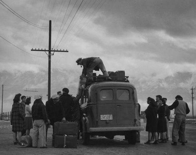 People of Japanese ancestry load a bus heading to the Manzanar War Relocation Centre in California, 1943. PHOTO: REUTERS