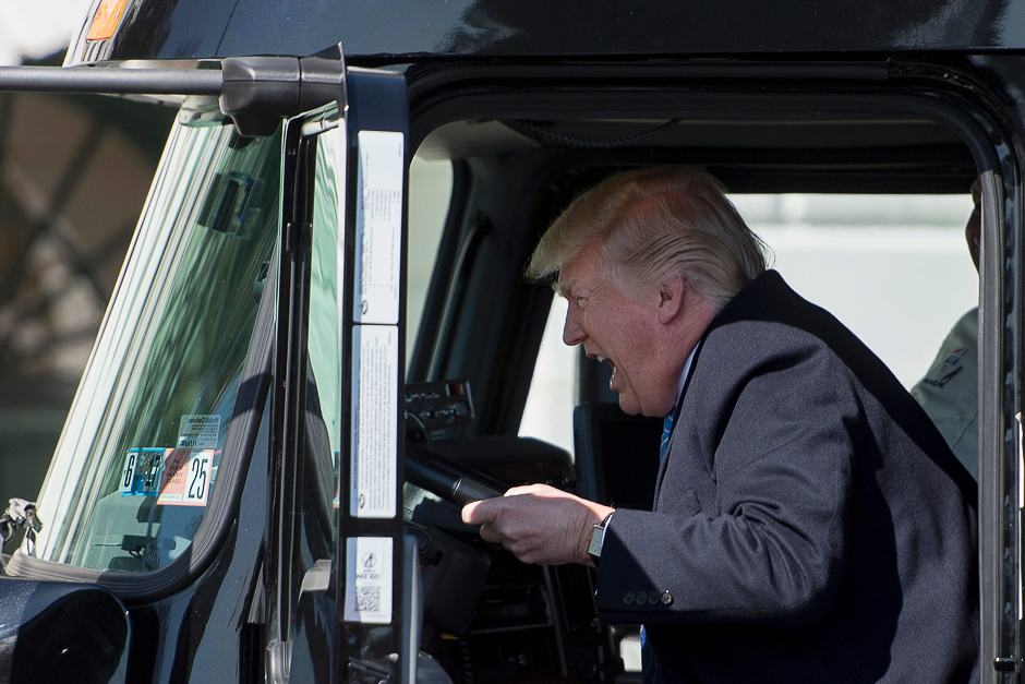 US President Donald Trump sits in the drivers seat of a semi-truck as he welcomes truckers and CEOs to the White House in Washington, DC to discuss healthcare. PHOTO: AFP