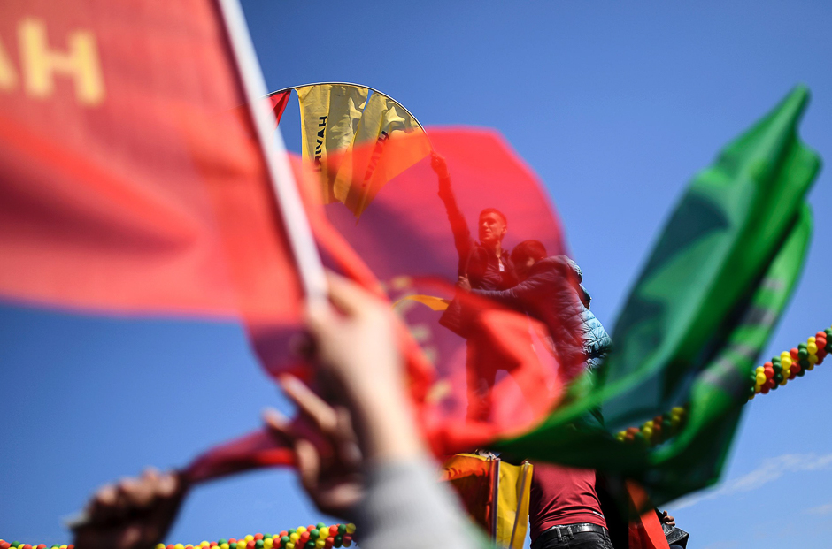 Young men wave flags as Turkish Kurds gather for Newroz celebrations for the New Year in Diyarbakir, southeastern Turkey. PHOTO: AFP