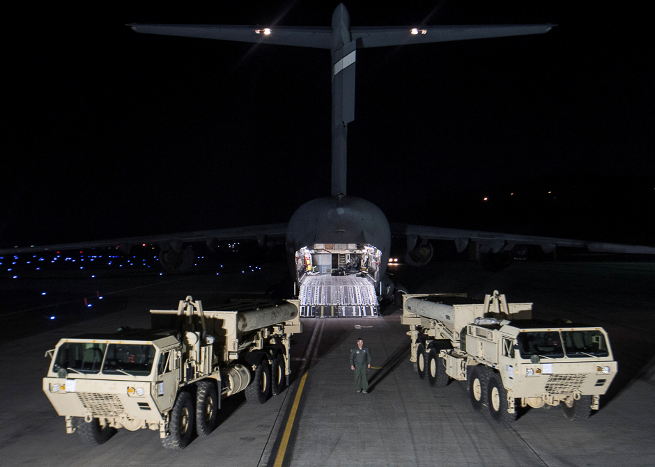 Terminal High Altitude Area Defence (THAAD) interceptors arrive at Osan Air Base in Pyeongtaek, South Korea. PHOTO: REUTERS 12.A girl is silhouetted against the sun standing next to Uzbek flags in Tashkent. PHOTO: REUTERS 