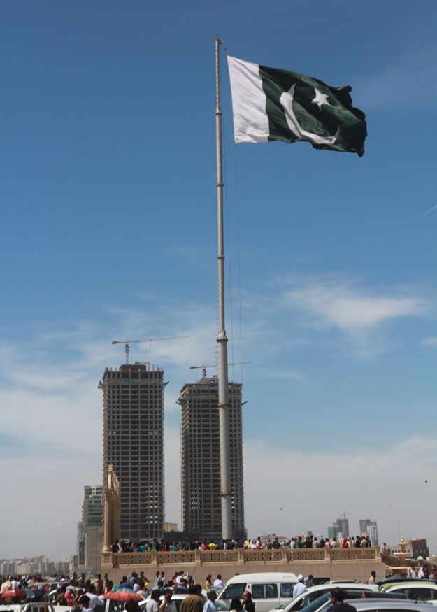 People all over the province hoisted flags to mark Pakistan Day. PHOTO: ATHAR KHAN/EXPRESS