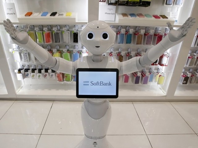 SoftBank Corp's human-like robot named 'pepper' is displayed at its branch in Tokyo. PHOTO: REUTERS