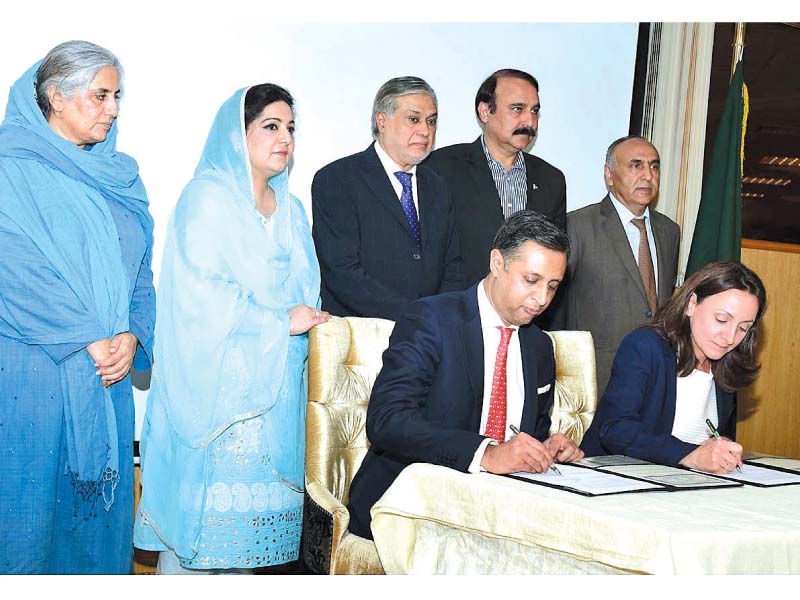 finance minister ishaq dar state minister for it anusha rehman and state minister for cadd tariq fazal chaudhry witness the signing of agreement for establishing computer labs in schools photo app