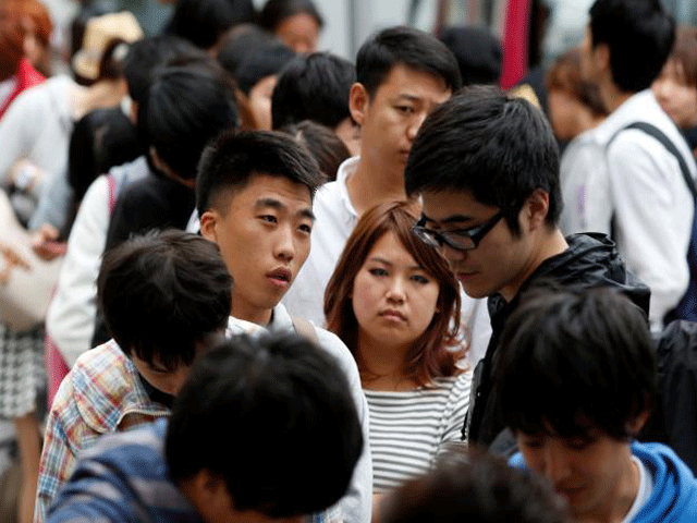 a group of chinese residents in japan shop in tokyo 039 s omotesando shopping district september 19 2014 photo reuters