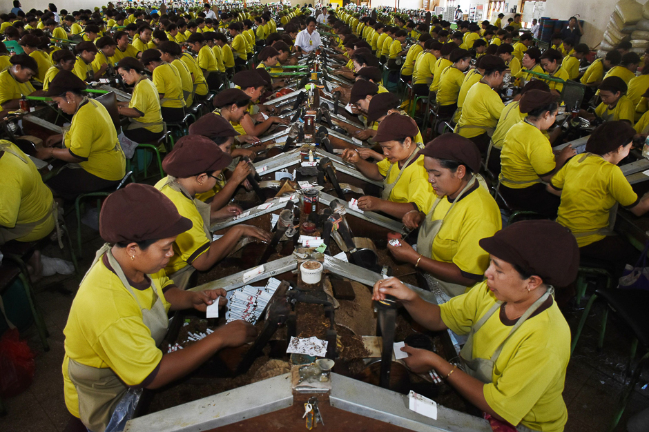 Employees at PT. Gandum, a local company that produces cigarettes, work at a factory in Malang. PHOTO: AFP