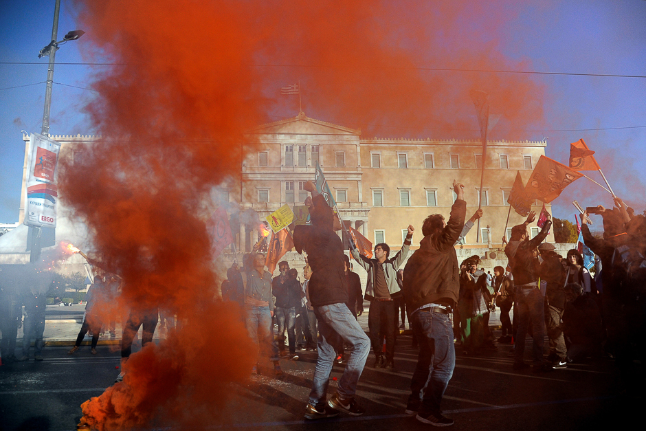 A flare is lit in front of the parliament as activists take part in an anti-racism rally in Athens, Greece. PHOTO: REUTERS