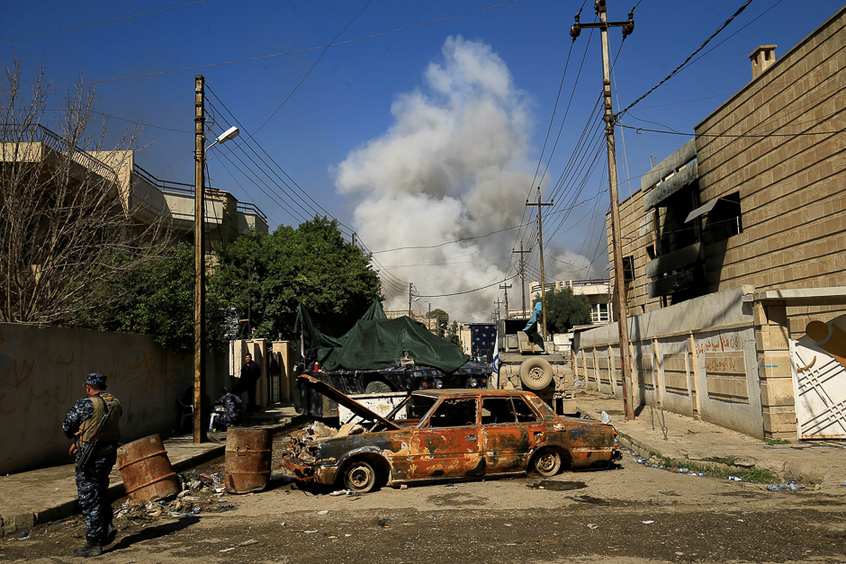 Smoke rises from a car bomb that exploded during a battle with Islamic State militants in Mosul, Iraq. PHOTO: REUTERS