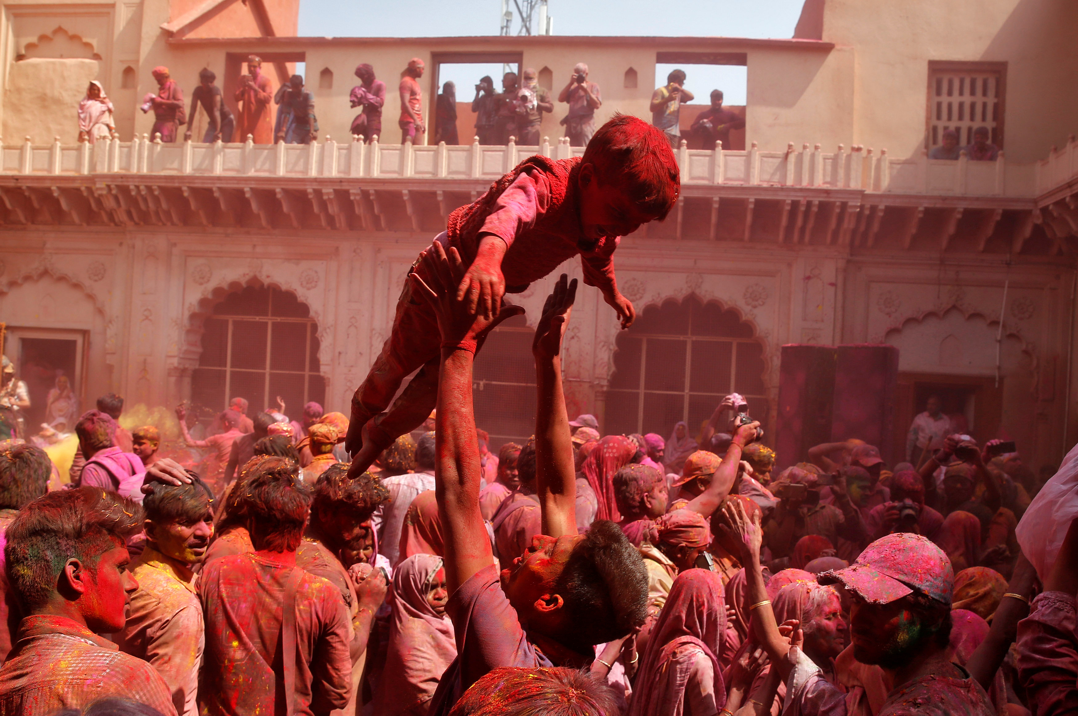 People take part in Holi celebrations in the town of Vrindavan in the northern state of Uttar Pradesh, India. PHOTO: REUTERS