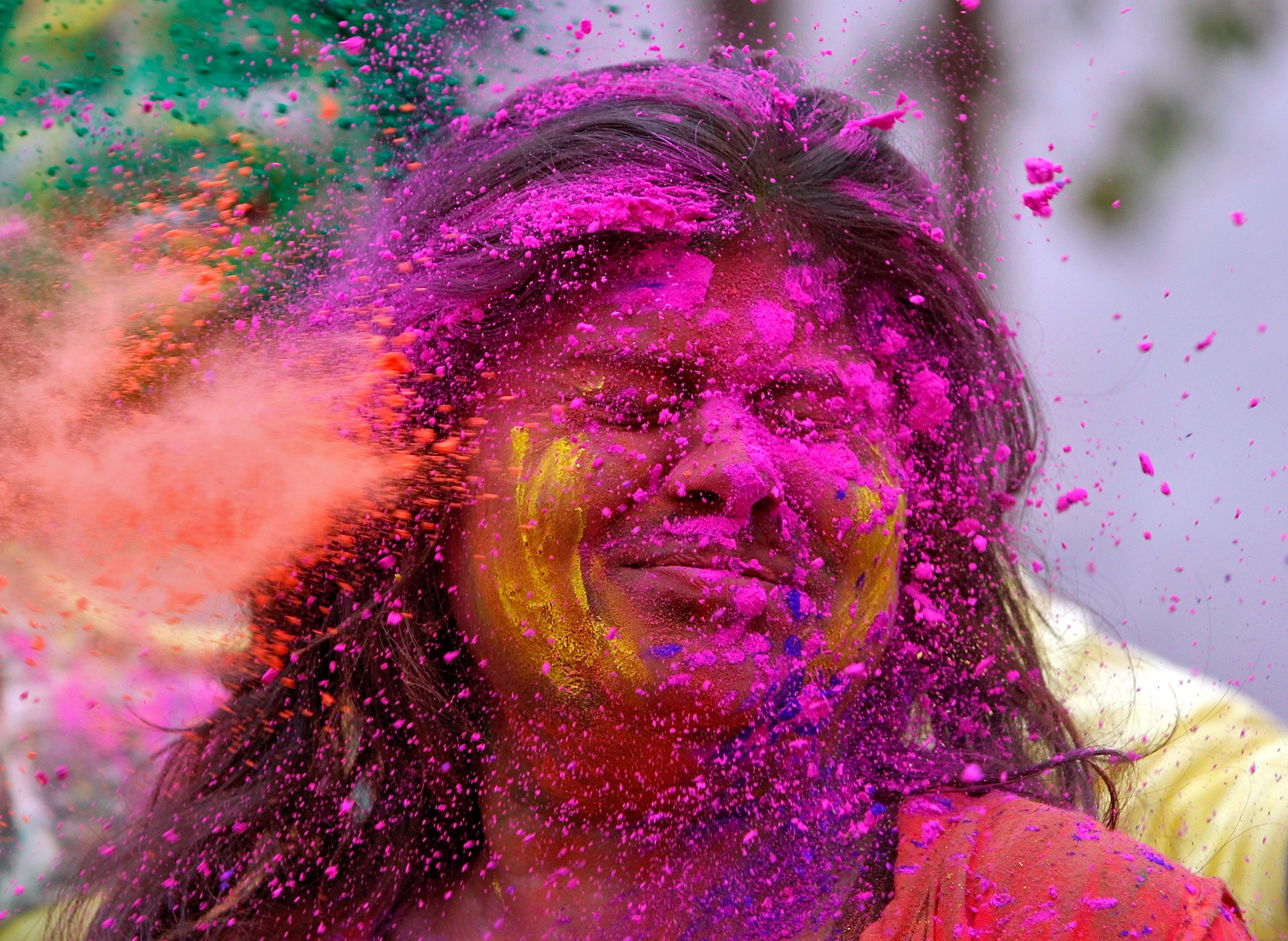 A college student reacts as coloured powder is thrown into her face, Agartala, India. PHOTO: REUTERS