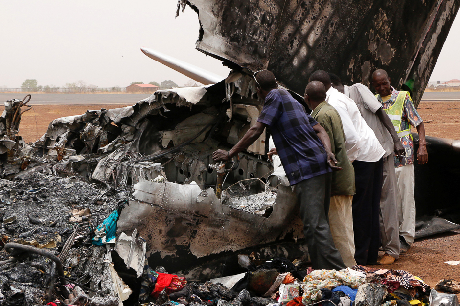 Aviation staff assess the wreckage of a South Supreme Airlines plane that crashed when it landed in the northwestern town of Wau from South Sudan's capital Juba. PHOTO: REUTERS