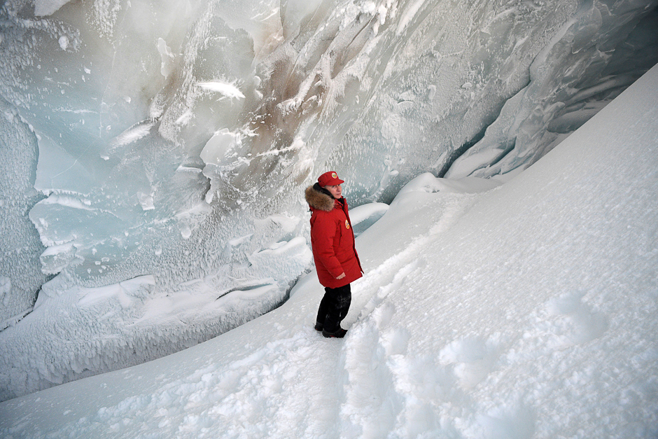 Russian President Vladimir Putin visits the cave of Arctic Pilots Glacier in Alexandra Land in remote Arctic islands of Franz Josef Land, Russia. PHOTO: REUTERS