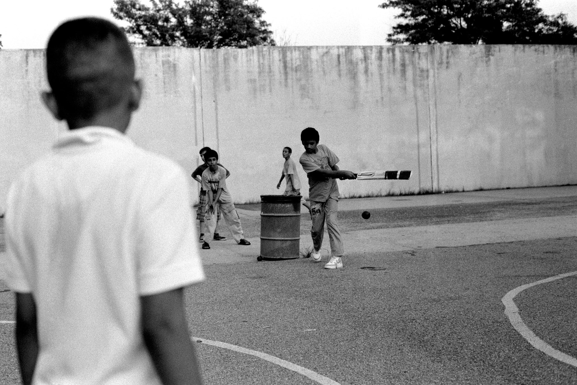 Pakistani American children playing cricket in the park, Brooklyn, 2011. PHOTO: ROBERT GERHARDT