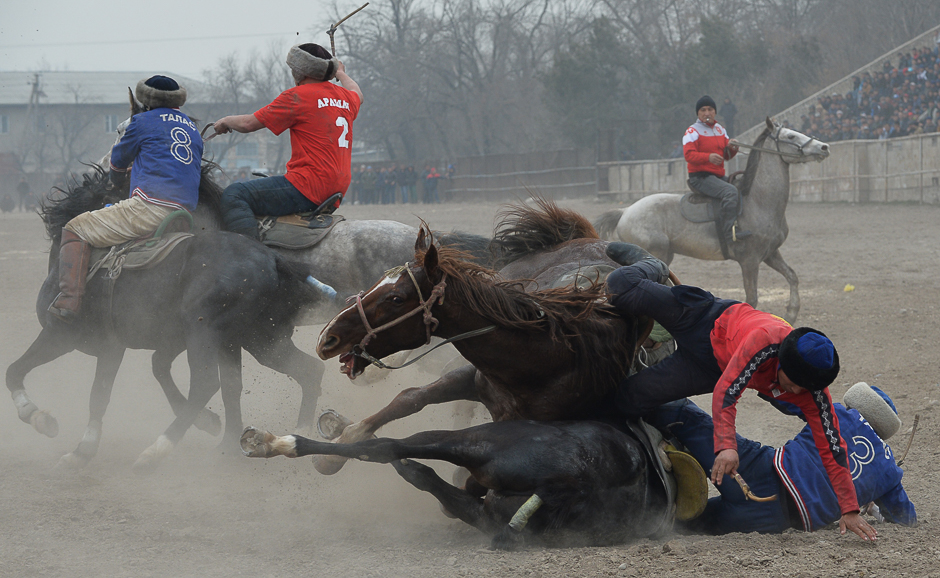 Kyrgyz riders play the traditional Central Asian sport of Kok-Boru (Gray Wolf) or Buzkashi (Goat Grabbing) during celebrations for Nowruz in Bishkek. PHOTO: AFP