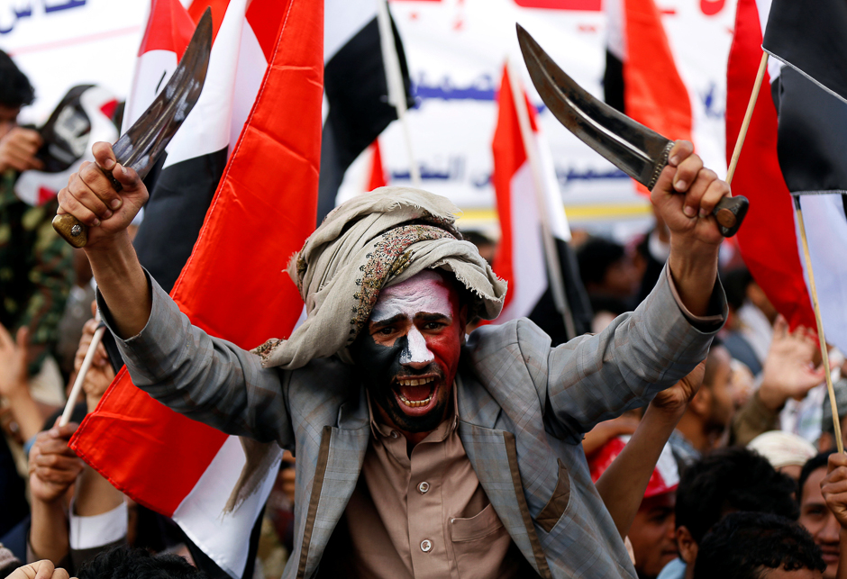 A man waves traditional daggers, or Jambiyas, as he attends with supporters of the Houthi movement and Yemen's former president Ali Abdullah Saleh a rally to mark two years of the military intervention by the Saudi-led coalition, in Sanaa, Yemen. PHOTO: REUTERS