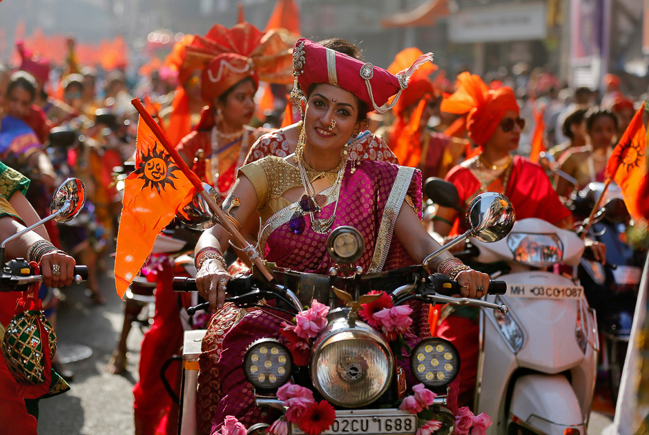Women dressed in traditional costumes ride motorbikes as they attend celebrations to mark the Gudi Padwa festival, the beginning of the New Year for Maharashtrians, in Mumbai, India. PHOTO: REUTERS